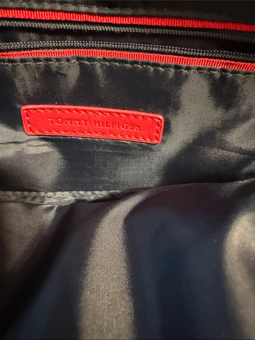 Tommy Hilfiger Red and White Monogram Backpack with Tan Trim.